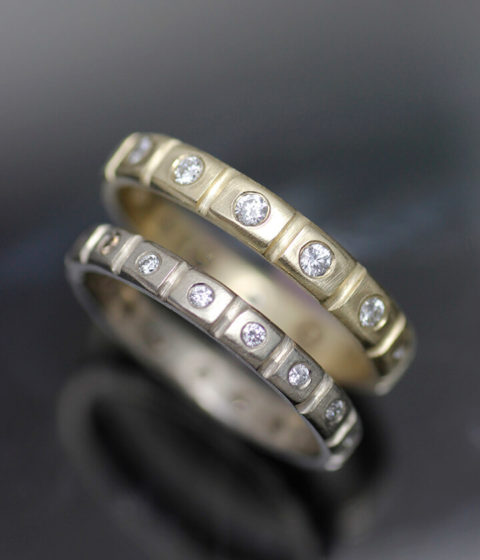 diamond studded crenelated bands in white or yellow gold