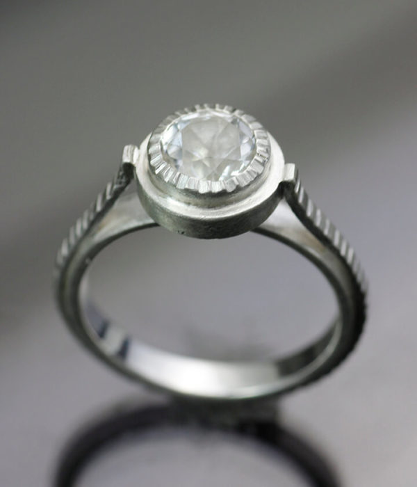 solar flare captured moon layered engagement ring side view
