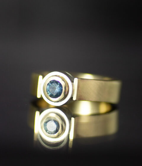 double bezel layered round canyon alt engagement ring in 14K gold and platinum with blue Montana sapphire scaled