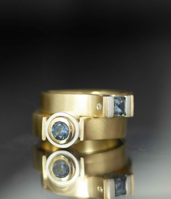 nonbinary engagement ring with Montana sapphire round and sqaure 14K yellow gold and platinum canyon set