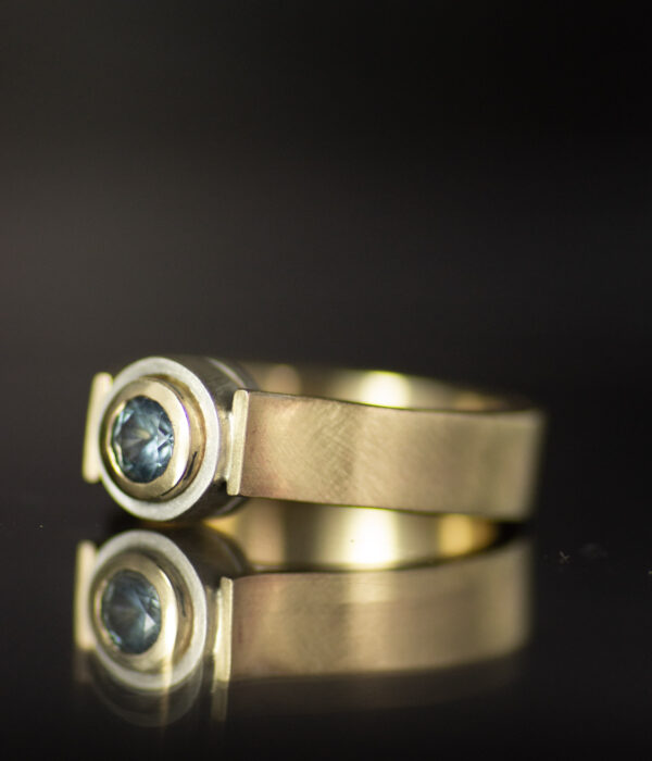 14K gold and platinum double bezel layered round canyon alt engagement ring with blue Montana sapphire side view