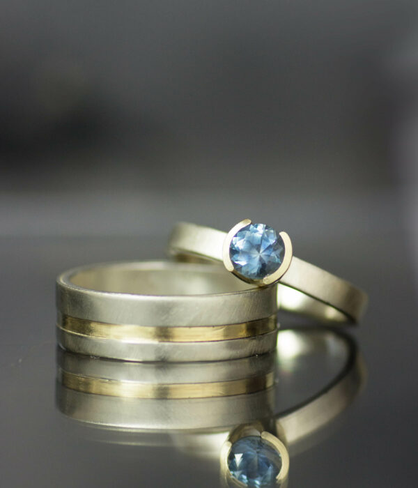 14K gold Montana sapphire half bezel solitaire engagement ring and mixed metals wedding band set