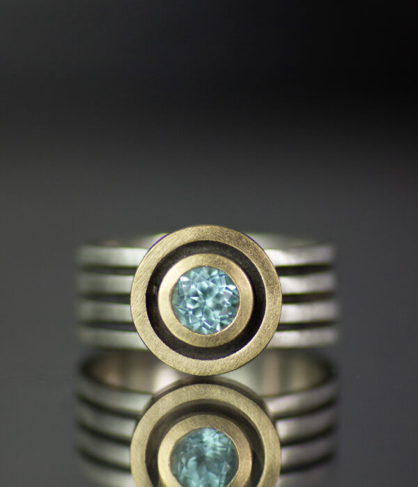 Close Up Intersecting Orbits Mixed Metals Aquamarine Sapphire Alternative Engagement Ring Scaled