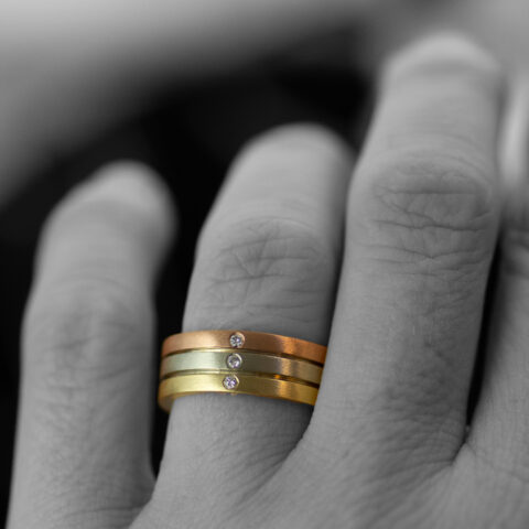 Tri Tone Triple Diamond Parallel Lines Mixed Metals Gender Neutral Wedding Band On Hand Scaled